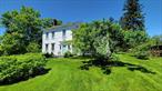 This historic 1800s home of James Mabbett sits on 4 plus acres with a pristine pond and extensive outbuildings.  The main house with its fine architectural details has been newly renovated and updated with new baths and kitchen, appliances, fixtures, mechanicals, gleaming hardwood floors, moldings and coffered ceilings. Enter the high ceiling elegant foyer which leads to a living room with a high-efficiency wood-burning fireplace, which opens to a dining room enhanced by corner china cabinets. Large windows throughout bring in ample sunshine. These rooms connect to an earlier section of the house, once a tavern and now an open plan kitchen-family room with a gas fireplace, a back foyer/mudroom and powder room. Ascending the graceful front staircase, you reach the primary bedroom with ensuite bath, two additional bedrooms and a second bath. From here you can access a large laundry/project room (with stairs to a partially finished attic), two more bedrooms and one bath, all of which can also be reached by a back staircase from the family room and a separate outside entrance.  To the rear of the house, attached to a two car garage, there are three large â€œstudiosâ€ currently used for art and entertaining but also suitable for workshop, offices or gym. A pond side pavilion complete the outbuilding ensemble. Hamlet zoning presents many possible commercial options. Convenient to the Town Park, village shops, schools, and other amenities as well as about 10 minutes to Metro-North, this is an old treasure for a new century. 24 hour notice required for accompanied showings.