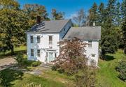 This historic 1800&rsquo;s home of James Mabbett was built on the eastern edge of Millbrook in the hamlet of Mabbettsville named for the family. In 2024 the fine architectural details were restored and the home renovated and updated with new baths and kitchen, appliances, fixtures, mechanicals, gleaming hard wood floors, moldings and coffered ceilings. Enter the high ceiling elegant foyer which leads to the formal living room opening to the formal dining room enhanced by corner cabinets. Large windows throughout bring in ample sunshine and views. Through the heated back foyer and mudroom to the early section of the home, the kitchen joins the family room. Back stairs lead to two bedrooms, hall bath, the large project/laundry room and access to the attic. Ascending the elegant carved front staircase, you reach the primary bedroom with en-suite bath, two bedrooms and hall bath. The hallway then connects to the early section of the house, which was originally a tavern. The 1920 large barn consists of three finished rooms currently used as a private art gallery, a loft, workshop and covered porch looking out to 4 lovely acres and a sparkling spring fed pond. A two-car garage is attached. Hamlet zoning presents many possible commercial options. Convenient to the Town Park, village shops, schools, and other amenities as well as 10 minutes to Metro-North, this is an old treasure for a new century. 24 hour notice required for accompanied showings.