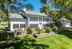 Sited on one of the most beautiful parcels in the Hudson Valley, this idyllic estate on a quiet country lane offers endless possibilities with the features of a mini-resort. Set on a knoll overlooking a gorgeous, spring-fed pond complete with gazebo, swing and swim-up dock, this historic country retreat includes the circa 1860 main house, a separate guest apartment with views of an additional pond, a gunite pool with pool house, a tennis court, golf green with three separate tee boxes, and a large sports barn which offers a fully equipped gym on the upper level and a first floor basketball court (and potential indoor pickle-ball court). The renovated vintage Colonial has five bedrooms, three and a half baths, a chef&rsquo;s kitchen with top of the line appliances (including three ovens and two dishwashers) perfect for cooking and gathering with an adjacent sitting room and fireplace; a spacious dining room with a delightful breakfast nook; a light-filled living room with a fireplace and hidden cabinets for storing wood, a family room/den with a fireplace, a wet bar and plenty of storage, as well as an all-season, window filled sunroom with radiant heated stone flooring and views to the back lawn and hot tub. The second floor offers four bedrooms, three newly done baths with linear drains, an office, a well-appointed laundry room and a walk-up attic. There is a Sonos sound system with indoor and outdoor speakers, whole house generator and security system. Outdoors, incredible recreational options abound with two swimming ponds, sweeping lawns, a 50 ft. heated gunite pool and a pool house complete with kitchen, full bath, laundry, internet and Sonos sound (indoor and out), golf, tennis and sports barn. Additionally, there is a three-car garage and guest apartment with a full bath and kitchenette, a second barn for storage or workshop and a fully enclosed and irrigated vegetable garden. The grounds are magical and noteworthy, with lovely stone terraces, perennial gardens, a charming playhouse, specimen trees, rock walls, running brook and a waterfall. A superb location less than 2 hours from NYC, minutes to the Taconic State Parkway, 20 minutes to Millbrook and Rhinebeck Villages, and convenient to all the Hudson Valley has to offer. Additional Information: Amenities:Guest Quarters, Marble Bath, Steam Shower, Tennis, HeatingFuel:Oil Above Ground, ParkingFeatures:3 Car Detached,