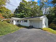 This charming three-bedroom, two-bath home sits on a semi-private .74-acre lot in a desirable neighborhood. With an open and airy layout, it features beautiful hardwood floors, a cozy wood-burning fireplace, and a spacious primary suite. The property includes an attached one-car garage and a full walkout basement, offering potential for additional living space. Perfect for people seeking one floor living. Ideal for those seeking room to grow!