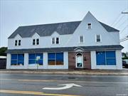 Prime Location in Downtown Bayshore, Commercial Mixed-Use Building approx. 14, 000 sq ft, on a Half-acre lot, Zoned BD with many uses. 1st floor open space with office and Bathroom. Second Floor, 3 Large Bedrooms, Living room, Kitchen 2 Full baths. 3rd Floor Huge Open Attic Space. Fenced Property