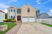 Welcome home to this custom-built 4-bedroom colonial with high ceilings, beautiful architectural brick details, and lots of light throughout. Features living room, dining room, new gourmet eat-in kitchen, granite and stainless steel appliances, and den with a gas fireplace. The spacious primary enSuite has a large bath with a tub & shower and closets. There are also three additional bedrooms and a full bath. Finished basement with plenty of storage, washer and dryer, and utilities and bathroom. Set on a beautifully landscaped cul-du-sac property with flowering perennials, with a backyard custom paver patio, Oversized 2 2-car garage and security system., Additional information: Appearance:Excellent, Interior Features:Lr/Dr, Marble Bath, Separate Hotwater Heater:Yes