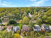 Discover the enchanting blend of history and opportunity in this stunning stone and cedar shake home, hitting the market for the first time in 70 years! Spanning four levels of grandeur, this home is brimming with character featuring soaring ceilings, hardwood floors waiting to be unveiled, and striking architectural gems like oversized windows, pocket doors, and multiple fireplaces. The main floor flows effortlessly from a grand foyer to a spacious living room, formal dining room, eat-in kitchen, and a sun-drenched sunroom that opens onto a stone patio, perfect for outdoor entertaining. Upstairs, the second floor boasts a primary suite with an ensuite bath and walk-in closet, plus two more bedrooms, an additional sunroom, a hall bath, and an original laundry chute for that touch of old-world charm. The third floor offers two more bedrooms and a full bath. A walkout basement features a den with a fireplace, plus updates like a new furnace and a dry basement thanks to a French drain system. Complete with an attached garage and an expansive, flat backyard, this home is steps from the train, shops, restaurants, and the Pelham Farmers Market. This is your chance to reimagine a timeless estate and make it your own where luxury meets legacy in the heart of Pelhamwood.