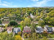 Discover the enchanting blend of history and opportunity in this stunning stone and cedar shake home, hitting the market for the first time in 70 years! Spanning four levels of grandeur, this home is brimming with character featuring soaring ceilings, hardwood floors waiting to be unveiled, and striking architectural gems like oversized windows, pocket doors, and multiple fireplaces. The main floor flows effortlessly from a grand foyer to a spacious living room, formal dining room, eat-in kitchen, and a sun-drenched sunroom that opens onto a stone patio, perfect for outdoor entertaining. Upstairs, the second floor boasts a primary suite with an ensuite bath and walk-in closet, plus two more bedrooms, an additional sunroom, a hall bath, and an original laundry chute for that touch of old-world charm. The third floor offers two more bedrooms and a full bath. A walkout basement features a den with a fireplace, plus updates like a new furnace and a dry basement thanks to a French drain system. Complete with an attached garage and an expansive, flat backyard, this home is steps from the train, shops, restaurants, and the Pelham Farmers Market. This is your chance to reimagine a timeless estate and make it your own where luxury meets legacy in the heart of Pelhamwood.