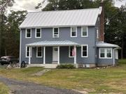 Welcome to this beautifully renovated, 100+ year old home situated on 2.5 private acres in the heart of Hyde Park. This charming residence has undergone extensive updates while preserving its historic character. The exterior features new siding and windows, with sections of the original standing seam metal roof thoughtfully replaced for longevity. Set back from the road with no immediate neighbors, the property offers peace, privacy, and a serene atmosphere. Inside, enjoy a modern living experience with a brand new 200-amp electrical service, updated wiring throughout parts of the house, and repaired plumbing. The home is equipped with a new gas water heater, providing efficient energy use. The standout feature is the completely remodeled kitchen, designed for today&rsquo;s discerning chef. It includes GE Profile stainless steel appliances, granite countertops, and stylish cabinetry. The home retains its classic charm with beautifully refinished hardwood floors in every room, except for the bathrooms, which have been updated with modern finishes. Crown moldings add a touch of elegance throughout, giving each space a refined look. Additionally, a brand new septic system, including tank and fields, ensures that the home is ready for years of maintenance-free living. This property is a rare combination of historic charm and modern upgrades, making it perfect for those who appreciate both timeless architecture and contemporary convenience. Whether you&rsquo;re looking for a peaceful retreat or a family home, this property offers an unmatched blend of comfort and style. Don&rsquo;t miss the opportunity to own this thoughtfully restored Hyde Park gem!