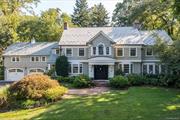 The perfect family home. Perched atop a manicured knoll, on a quiet cul de sac, sits this stunning colonial in the coveted neighborhood of Flower Hill Manhasset. Completely renovated in 2004, this home boasts over 6500 sq ft of living space which includes, 5 en-suite bedrooms, a large family room with 10 ft ceilings, 2-sided gas fireplace, custom paneling and built -ins, a large eat-in kitchen featuring Sub-Zero and Wolf appliances, marble countertops, and 10 ft island. Formal dining room, living room with wood burning fireplace, custom mahogany paneled tv room with coffered ceiling, office gym and mudroom. Custom details throughout.