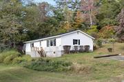 Nestled on a peaceful dead-end road in Dover Plains, this charming house is a hidden gem waiting to be discovered. With 1400 square feet of living space, this cozy abode offers a perfect blend of comfort and functionality. Step inside, and you&rsquo;ll be greeted by an inviting open floor plan that seamlessly connects the living areas. The large eat-in kitchen is a home chef&rsquo;s delight, featuring ample counter space and a brand-new refrigerator that&rsquo;s sure to make meal prep a breeze. This lovely home boasts three bedrooms, including a spacious primary bedroom, providing plenty of room for family or guests. The single bathroom is well-appointed and ready to accommodate your daily routines with ease. For those chilly nights, cozy up to the wood pellet stove in the basement, which adds both warmth and character to the home. It&rsquo;s like having your own personal fireplace, minus the hassle of chopping wood or dealing with smoke signals! Step outside onto the back deck, and you&rsquo;ll find the perfect spot for your morning coffee or evening relaxation. The property also features an outdoor barn (sold as is) that&rsquo;s waiting for your creative touch. Perhaps a workshop, or art studio. Conveniently located just a short distance from the Dover Plains train station and local amenities like Dover Deli Food, this home offers the perfect balance of small-town charm and modern convenience. So, whether you&rsquo;re a commuter, a nature enthusiast, or simply someone looking for a peaceful retreat, this delightful property might just be the one you&rsquo;ve been searching for. Don&rsquo;t let this opportunity pass you by  your next chapter awaits! **GPS Please put in 13 Glen Hill Amenia, NY - House is located on dead end.**