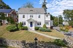 Curb appeal! On a tree-lined street with iron gas lamps, step into the timeless elegance of this 1930 center-hall colonial, a mile from Vassar College, in one of the City of Poughkeepsie&rsquo;s most desirable neighborhoods. Perched on a hill, this 4 bedroom, 2.5 bathroom beauty has a classic slate roof, hardwood floors, made-to-order moldings and numerous double doors that permeate vintage charm. Enter through a stunning portico that sets the elegant tone and the spacious living room boasts a cozy fireplace perfect for gatherings or quiet evenings. The three-season enclosed room offers a tranquil space for relaxation or a home office. An additional formal den provides a private workspace. Upstairs, primary bedroom has dressing room. Outside, the manicured front yard enhances the home&rsquo;s stately appearance. Conveniently located near shops, restaurants and a five-minute drive to the PK Train Station, this home offers historic charm and modern convenience in a beautiful part of the city. Additional Information: ParkingFeatures:2 Car Attached, Appliances: Electric Water Heater ConstructionDescription: Wood Siding,  FoundationDetails: Slab,