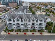 Welcome to Your Coastal Sanctuary: A Stunning Upper-Level Townhome. Step into a world where luxury meets tranquility in this pristine 1900 Square Foot upper-level unit, perfectly nestled just moments from the stunning shores of Monroe Beach. With vacation-year-round vibes, Long Beach invites you to experience the ultimate blend of relaxation and convenience, only 50 minutes from the hustle and bustle of NYC. As you enter, be captivated by the pristine open concept living area with gas fireplace that warms the spacious living area, bathed in natural light from not one, but three charming balconies-two East-facing, perfect for morning sunrises, and one West-facing, ideal for sipping sunsets. The expansive primary bedroom suite serves as your personal retreat with an airy vaulted ceiling and second gas fireplace, featuring a generous walk-in closet and a luxurious five-piece bath that transforms daily routines into indulgent experiences. Need a space for work or workouts? An additional office area is seamlessly integrated, catering to your lifestyle needs. Enjoy cooking in the eat-in kitchen, adorned with stainless steel appliances and gleaming hardwood floors that flow throughout the home. Recessed lighting adds a touch of sophistication, creating an inviting atmosphere for both quiet evenings and lively gatherings. Convenience is key with in-unit laundry, a designated garage spot, and an additional parking spot, ensuring that your coastal living experience is as effortless as it is enjoyable.This pet-friendly gem not only offers a beautiful space to call home but is also rentable, making it an exceptional investment opportunity. Park with ease in your garage spot plus an additional parking spot. Explore nearby shops, hop on the LIRR for one of 27 daily trips to NYC, or take a leisurely stroll along the famous 2-mile boardwalk. This townhome isn&rsquo;t just a place to live; it&rsquo;s a lifestyle waiting for you., Additional information: Appearance:PLATINUM