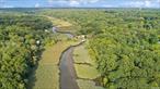 Welcome to your future home on the Nissequogue River in beautiful Smithtown! No need to ever leave when you can experience the Fall foliage from every window, with stunning unobstructed panoramic views of the river and protected wetlands and nature preserve......This private and incredible property sits directly on a gorgeous and stately setting with direct river access right from your own backyard for fishing, kayaking and canoeing!! Quiet and, serene, this bird lover&rsquo;s paradise offers not just a home, but a lifestyle perfect for nature lovers and outdoor enthusiasts. Just shy an acre, minutes from the center of town and close to all, this super convenient location offers panoramic views which are the main focus for this ranch style home. Entertaining outdoors is easy with the new large exterior decking just perfect for gatherings and parties ! Expansive slate patio below also overlooks the stunning river views and runs the length of the house.... enjoy lounging on lazy afternoons in a glorious setting most dream about! As soon as you enter this gorgeous home with breathtaking setting, you are welcomed with a wall of windows overlooking this unique property. Huge master bedroom has en-suite bath and 2 closets overlooking the beautiful views and two additional bedrooms and another full bath on entry level. Large EIK is loaded with charm and character, with a brick wall, oak cabinets, built ins and a super nice cozy space.....Bring your telescope to enjoy the bright and beautiful sun drenched room with wrap around windows and skylight...... watch the nature surrounding you in this glorious sunroom just next to the kitchen and across from spacious laundry room and oversized 2 car garage. Additional nice features include new wood floors. IGS and security system, Generac generator provides immediate power backup. Lower level encompasses 35 ft long additional den w/large windows overlooking the river, built in stereo and record player w/in-wall speakers and sound system wired throughout entire home, automatic power outdoor vertical shutters and brick fireplace recently converted to gas. There is also another full bath and a large office on lower ground level which can convert to 4th bedroom, plus a playroom/craft room with built-in storage. Additional storage room. Extensive brick and slate work on entire property. Home has been lovingly maintained by one owner, now make it your own!!!