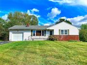 Just outside the Village of Rhinebeck, this 2 bedroom, 2 bath ranch is sited high on a beautiful lot that overlooks a horse farm in back. There&rsquo;s a large deck and patio in back and a private, level yard. There is a 21-foot living room, an open dining room, and a nice kitchen. There are two bedrooms, one with an ensuite bath and a second full bath in the hall. This home has an oversized attached one car garage, a full unfinished basement, BB hot water heat, newly re-finished oak floors, and has been recently painted inside. Brand new driveway. We require a credit score of at least 680 and good references.