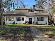 Set on a lovely tree lined village street, this home features an extra large living room with wide plank floors and an impressive stone fireplace. The kitchen has newer cabinets, granite counters and a center island. There are two screened in porches on the side of the house. 2 of the bedrooms are on the first floor with two more upstairs. Their are full bathrooms on each floor. The home has a two car tandem garage under the house. Inground sprinklers. New Burnham Boiler. Natural gas heat and cooking. Sewers.