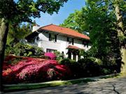 Move-in ready. This majestic renovated four-bedroom Mediterranean villa near Bronxville is set on a lushly landscaped large corner property. The arched, covered portico, massive stone walls, terraces, patios, lawn sprinkler irrigation system and fully operable in-ground gunite mini pool complete the private outdoor oasis. The flagstone walkway leads to a refined entry door with brass lion-head knocker and into the grand foyer featuring a sweeping curved staircase and distinctive balustrades. Center hall layout is perfect for entertaining and relaxing, with leaded-glass double French doors opening to the huge living room and elegant dining room, both with oversized moldings, gleaming maple floors and custom fireplace. A paneled room with three exposures, bay window and built-ins can be used as a home office or bedroom.  -Separate lower level in-law apartment.-  The updated kitchen and butler&rsquo;s pantry have granite counters, a breakfast nook and mud room. Upstairs, the huge ensuite primary bedroom has its own private 220 SF terrace, cedar closets, and enormous tiled bath with separate shower room. Two additional bedrooms and bath are on the second level; also there is a half bath with gold fixtures on the first floor. The lower level, with rec room, laundry, full bath and playroom, accommodates au pair or in-law living. The heated, two-plus car garage is below the house, with direct access. The 1, 500 SF attic with cathedral ceiling (not included in house area) can be finished to suit your needs. New 200-amp service and upgrades throughout. Freshly painted, inside and out. Special Concession For Cash Transaction. Ultra low taxes.