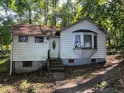 Three bedroom, one bathroom cottage on a corner lot in Hillside Lake! Great opportunity to build your dream home in a lake community. Property being sold with no interior access/no inspections. See agent remarks. Close to shopping, schools and amenities. Sold as-is. Buyer to pay NYS and any local transfer taxes. Cash offers only with proof of funds. **Please see agent remarks for access, showing instructions and offer presentation remarks.** Additional Information: HeatingFuel:Oil Above Ground,