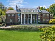 This magnificent 7 bedroom, 5 1/2 bath 1918 Georgian Colonial situated on almost a full acre of private property in coveted Lawrence Park is truly fit for a king! With over 7, 000 sqft of elegant living space-there is room for everyone. The gracious entry hall opens to the living room with a wall of French doors overlooking the lush landscaping. The banquet size dining room with a fireplace is attached to the gourmet white kitchen and eating area with Wolf Range, Sub Zero refrigerator, Bosch dishwasher & quartzite countertops. Off of the kitchen is a unique sunken family room. The sunroom and library are adorned with spectacular Moroccan plaster ceilings. An open staircase leads to a primary bedroom with fireplace, two walk-in closets, a sitting room and a spa bath. There are four additional bedrooms on the second floor and 1, 474 sqft of living space on the third floor. The lovely guest cottage is the perfect place for guests or a pool house! This exclusive property is fully gated and only a 28 minute train ride to Manhattan.