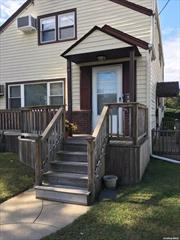 Spacious two-bedroom apt. 2 car parking one garage space, and one driveway All large rooms. Hardwood floors. Tenant responsible for heat, gas, electricity, and cable Close to school and public transportation Tenant has use of front deck.