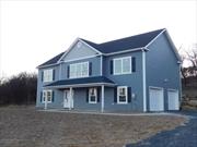 Under Construction Colonial Bilevel with 4 bedrooms and 3 full baths. Vaulted high ceilings with open floor plan. Plan includes kitchen with island, fireplace in the family room, hardwood floors throughout the home and a 14 x 14 deck off the dining room/kitchen area. 2 car garage. A/O