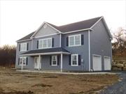 Under Construction Colonial Bilevel with 4 bedrooms and 3 full baths. Vaulted high ceilings with open floor plan. Plan includes kitchen with island, fireplace in the family room, hardwood floors throughout the home and a 14 x 14 deck off the dining room/kitchen area. 2 car garage.