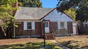 Brick and Siding Cape with Fireplace. Over sized 60x125 property. Great Neck South School District