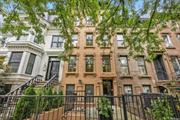 Bed-Stuy Boutique Condo with Tax Abatement, a classic Brooklyn Brownstone, reimagined for today. A gated front garden and stunning late 19th-century facade, Italianate in style, welcomes owners into four distinct residences. Each suite offers soaring ceilings, oversized windows, recessed lighting, and rustic wide plank flooring. Gas fireplaces set the tone for quiet evenings at home. The sleek design of each kitchen features bold black and white quartz waterfall countertops with complimenting and stylish matte black stainless-steel appliances and soft-close cabinetry that elevate the design. High-quality sound by the Heri do home audio speaker system and a virtual doorman bring a 21st-century touch to this quintessential townhouse. Luxurious baths with warm tones of brown and gold throughout quartz tile, contrasting dual-head rainfall showers, and backlit anti-fog mirrors. Nearby favas, including Peaches, Chez Oskar, Coyote, and Macosa, mean dining choices are endless. The Greenspaces of Herbert Von King are a short distance away. Residence 3: Feels like the heart of the home. A bright two-bedroom one-bath floor-through with high ceilings, decorative moldings, fixtures, and features as all of the other units, and the higher floor means even more light as the forward-facing windows just started to peek above the treelined. The introduction of a new color choice for the focal wall of the gas fireplace feels fun, retro, and homey and is a perfect contrast to the sleeker and more modern kitchen. An in-unit laundry closet means ease, and opening the rear doors of the South facing Juliet balcony (which can be accessed from both bedrooms) makes the unit both bright and breezy. Cooling and heating are Fujitsu split units throughout.