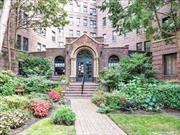 Step into this elegant one-bedroom, top-floor corner unit in the historic Wychwood building, where timeless pre-war charm meets modern convenience. With 10-foot ceilings, oversized windows, and abundant natural light, the space offers stunning sunset views and glimpses of Manhattan&rsquo;s skyline. The unit features a wall of mahogany custom cabinetry, brass hardware, and multiple walk-in closets. The renovated kitchen boasts wood cabinets and stainless steel appliances, complemented by a tastefully updated bathroom. Low monthly maintenance covers taxes, water, sewer, and heating, with only electric and cooking gas as extra costs. The building offers a serene private garden with a barbecue, a live-in super, and a state-of-the-art laundry room with app-controlled machines. Residents also enjoy access to Parkwood Pool, tennis courts, ice-skating, and Steppingstone Waterfront Park and Marina. Conveniently located near the LIRR, restaurants, and shops, this unit provides a peaceful retreat with easy access to NYC. Renovated by a renowned architect, the unit includes luxury upgrades such as a drop ceiling with chandelier and custom silk drapes that will remain. A must-see!