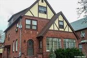 HUGE PRICE REDUCTION. Charming and spacious Tudor-style brick home, beautifully maintained and located mid-block in the historic Yorkshire section of Lynbrook. This 4/5-BR house features a welcoming entrance foyer with a closet, a spacious living/dining room with a wood-burning fireplace, and a large eat-in kitchen with a new refrigerator and GAS stove. Enjoy a sunlit winter garden in the lovely sunroom, and the bonus library/office on the third floor adds extra versatility. The house boasts hardwood floors throughout, abundant storage and ample closet space, and a partially finished full basement. Outside, you&rsquo;ll find a private driveway, a 2-car garage, and inground sprinklers. Move right in and enjoy this delightful home, conveniently located near the LIRR, bus routes, schools, and shops.,