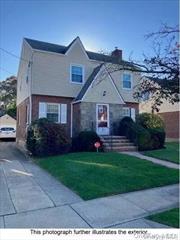 Charming Brick Colonial on Residential Street. Sun-Lit Living Room with Beautiful Hardwood Floors. Formal Dining Room. Eat In Kitchen. 3 Large Bedrooms.  1.5 Bathrooms.  Full Basement.  Attic Storage.  Garage.  Covered Rear Patio. Outside Entrance to Yard off Mudroom. Gas Heat. Excellent School District.  Close to Transportation.