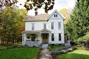 Own The Jewel on Main Street! Built in 1884 by A.P. Dubois, experience Victorian era charm in the heart of Livingston Manor. Walking through the original iron gate to the first of three porches, stained glass doors beckon you to a stunning foyer adorned with original woodwork, 10&rsquo; ceilings, gas light fixtures, and pocket doors. The hand-carved newel post and cherry banister showcase the craftsmanship of the time. Enjoy a spacious four-bedroom layout with two full bathrooms, including a beautiful clawfoot tub. Second Fl laundry is next to the back stairs which lead to the 3rd floor attic offering additional potential as studio, recreation space, or loft apartment. Double parlors, potential 5th bedroom, formal DR, and kitchen with original built in cabinets round out the first floor. With General Business (commercial) zoning, 150&rsquo; of Main St. frontage, off street parking, and almost an acre of buildable land this property presents a unique opportunity for business/residential use!