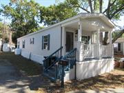 Located in a 55 and over community is this 2013 manufactored home. Features include 2 bedrooms, 1.5 baths, living room, kitchen, laundry area, central a/c, propane heat and covered front porch. Lot rent includes water, trash collection, cesspool maintenance, and road mainenance.