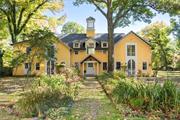 Set on nearly 4 acres straddling a private lane in Snedens Landing, this spectacular house was built in the 1980s as a family house for a world renowned actor / comedian. Award winning architecture firm Shope Reno Wharton incorporated elements of the Yellow Barn, the original structure on the property, into a new and expanded masterpiece. Inspired by the design language of the charming 19th century structure, the architect created a 5, 177 sf house and free standing 2 car garage with office/studio above, with all modern conveniences, that harkens back architecturally to the charming Yellow Barn and the bygone days of river village life in Snedens Landing. #19, set on nearly 2 acres, was originally part of the Claggett family estate, which included the architecturally significant Cedar Grove house next door. Light streams into the striking living room featuring beautiful architectural details including 15&rsquo; ceilings, wood burning fireplace, office nook with built-in day bed, unique windows and sets of french doors leading to a wrap around porch, large lawn, and treehouse. Every room is spacious including the first floor primary suite and formal dining room. The recently renovated kitchen with large island and state of the art appliances, is located in the footprint of the Yellow Barn and incorporates the original 19th century wood burning fireplace. A laundry room and en suite au pair / housekeeper bedroom are located off the kitchen. Up the prominent central staircase, bathed in light from the cupola above, the second story of this custom house features an enormous primary suite with high ceilings, 2 walk in closets, and a full bath on one side of the house, and 2 generous-sized bedrooms with shared bath on the other. Also included in the sale is 28 Ludlow Lane, an additional 2 acre parcel, on a separate / buildable tax lot. Following in the tradition of Snedens as home to artists / creatives, residents of this house have included well-known actors, a composer, and, currently, artists whose work appears in museums around the world. Snedens Landing, located only 11 miles north of the GW Bridge, is known for its country feel with easy access to NYC, 90-year-old tennis association, award winning schools; and is surrounded by parkland and the Hudson River.