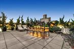 This historic two-bedroom, two-bath home, with an exclusive roof terrace directly connected to the great room, spans over 2, 700 square feet. Located in the P.S.90 Condominium with its iconic gothic architecture, residence 6G has been meticulously updated and is on the market for the first time since the buildingâ€™s debut.Enter the 1, 630 sq. ft. interior through a discrete foyer to a grand great room that offers vast open-concept indoor/outdoor living. With almost 1, 100 sq. ft. of fully landscaped private outdoor space, the terrace is equipped with a grill, lounge chairs, a dining table and chairs, and access to outdoor electricity and water. This exclusive terrace extends the length of the home and provides both greenery and privacy. Windows on the north and west walls offer natural light pouring into the kitchen, a formal dining area accommodating up to twelve, and an oversized living area.The chefâ€™s kitchen is complete with luxury stainless steel appliances from Bosch, Cove, and Miele. A Caesarstone breakfast bar and island accommodate four, and, with a separate pantry, provide plentiful additional storageThe king-size primary bedroom offers two large windows with a view of the private landscaped terrace and is set away from the living area, providing a sanctuary within the home. This suite is complete with an en-suite bath, including a soaking tub, a separate glass-enclosed shower, and a walk-in closet.A second bedroom has a southern view, two large closets, and an off-suite three-fixture bathroom. The conveniences of this home include an in-residence laundry center with a full-size washer, vented dryer, and ample storage.Formerly a public school, P.S.90 was reborn in 2010 as a condominium and has since become a coveted location in uptown Manhattan. This pet-friendly building has an attended lobby, a live-in super, a fitness center, storage, bike storage, a media room, an art room, cold storage, and a private community garden.Nearby are Jackie Robinson Park and St. Nicholas Park. Recreational activities include an outdoor pool, dog runs, playgrounds, outdoor running tracks, cycling, soccer, football, baseball/softball, basketball, tennis, and pickleball. Enjoy local coffee shops, restaurants, and bars. The location is convenient to City College, Columbia University, and area hospitals. Commuting is easy with the nearby A/B/C/D/3 train lines, multiple bus lines, public street parking, and Citi Bike.