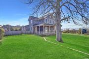 Charming 1902 Colonial in the Village of Patchogue with Stunning Views of the Great South Bay Step into this historic Colonial, nestle near the heart of the Village of Patchogue, just steps from the Great South Bay. Built in 1902, this home captures the essence of classic Long Island architecture with its cedar shake exterior and front porch offering timeless charm. Upon entering, you&rsquo;ll be greeted by an open floor plan highlighted by original exposed wood beams and wide plank hardwood floors. The spacious living room boasts abundant natural light and features a cozy wood-burning stove, perfect for those cool autumn nights. The expansive sunroom offers panoramic views of the private backyard. The high ceilings, large windows, and skylights provide a bright and airy space for cooking and entertaining, leading directly to the deck. Outside, the property includes a generous yard, with detached garage and a pergola at the side yard you will also find an outside shower ideal for being refreshed when returning from the bay. The tranquil bay views from the second floor creates a serene backdrop. This home is a perfect blend of historic charm and peaceful retreat while still being close to the vibrant community of Patchogue. With easy access to restaurants, shops, and the waterfront, this is truly a one-of-a-kind opportunity.