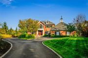 Welcome to 18 Kingwood Lane, a private cul-de-sac residence in the prestigious Spackenkill area, Kingwood Park, just a train ride away from New York City. This elegant red-brick Georgian Colonial spans over 5, 300 sq. ft., offering a seamless blend of sophistication and comfort. Arriving at the home, you are greeted by a Belgian block-lined driveway and meticulously landscaped grounds. The custom Mahogany front door opens into a grand two-story foyer, flowing into a traditional study featuring custom-built shelves and a marble fireplace. The light-filled great room, with its 10-foot ceilings, fireplace, and wet bar, offers multiple French doors leading to a blue stone terrace with breathtaking views of the Hudson Valley. Perfect for relaxation or entertaining, this space is ideal for unwinding. The spacious kitchen leads into a formal dining room framed by a hand-painted Hudson Valley mural. The main level is complete with a powder room and a slate-floor mudroom, offering side deck access for outdoor grilling and entertainment. Upstairs, the primary suite exudes luxury with custom moldings, a tray ceiling, his-and-hers walk-in closets, and a lavish en-suite bath with radiant-heated floors, soaking tub, steam shower, and linen closet. The fully finished lower level features 10+ foot ceilings, a den, gym or second office, a full bath, kitchenette, second laundry room, and living area, making it an ideal in-law or nanny suite. Multiple French doors lead outside to a resort-style outdoor space featuring a 20x40 gunite pool, overflowing spa, blue stone patio, stone walls, and a covered al fresco dining area an entertainer&rsquo;s dream. Modern conveniences include a whole-house generator, new High efficiency propane boiler, Carrier heat pumps , Sonos sound system, irrigation system, and an EV charger. The home includes a two-car garage with room for expansion to a three-car setup, and an adjacent vacant lot is available for purchase, offering the possibility of more privacy or creating a future compound. Excellent location, minutes to multiple championship golf courses, Route 9, Oakwood Friends School, Vassar Hospital, Poughkeepsie Train Station, Marist & Vassar Colleges, downtown Poughkeepsie, the Walkway over the Hudson, culinary grade restaurants, shopping & more! This home is a true masterpiece, combining all things luxury & charm in the heart of the Hudson Valley!