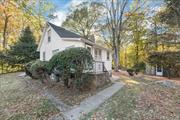 This delightful 2-bedroom home offers a blend of cozy comfort and outdoor privacy. Relax in the living room with its crackling fireplace or retreat to the den for quiet moments. This home offers a lifestyle that marries nature, art, and comfort, with a separate studio tucked in the trees, a second, half finished garage perfect for use as a home office, and the attached .67 lot (included with total acreage) that brings coveted lake rights to Lake Oscawana Beaches. All within an easy drive to the Taconic Parkway for commuting convenience.