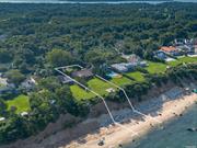 This Expanded Ranch sits high on the Bluff w/forever views over the Sound. Living room w/fireplace & sun room on the waterside. Open kitchen & dining. Hardwood floors. There are 4 bedrooms, including a large primary ensuite. Full basement. The community has a private deeded beach, tennis, basketball, bocce & pickle ball courts.