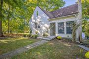 Must see this charming craftsman style unique home with hardwood floors throughout. Feel the warmth of his pre war home when you step into the enclosed porch/sunroom surrounded by windows. First level features a large eat in kitchen with butcher block countertops, cozy living room with wood burning fireplace surrounded with stone with windows facing the enclosed porch for an open air look, two spacious bedrooms and full bath. Second level is a walk up finished attic to a huge primary suite with private sitting area and large full bath. Large walk out basement with sliding doors to yard is a versatile living space which can serve as a family room, game room or anything you want to meet your family needs. Park like backyard with large shed is perfect for entertaining, gardening or just relaxation,  Exterior has parging to make this home energy efficient and air tight. Home is conveniently located with everything only minutes away including shopping, restaurants, and transportation.