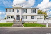 Welcome to this Beautiful Wide Line Hi-Ranch Home in the highly sought-after Seaford Harbor Community. The versatile layout offers a perfect blend of comfort and functionality. Step into a Stunning Two-Story Foyer, where soaring ceilings and an abundance of natural light create a welcoming, open atmosphere. The first floor features a grand family room with a cozy gas fireplace, perfect for family gatherings. Sliding doors lead to the backyard, blending indoor and outdoor living spaces ideal for entertaining. Also on this level, is a spacious den/playroom, an exercise room or office, guest bedroom, a full bathroom, a separate laundry room and access to your garage. Upstairs the sunlit second floor boasts a formal dining room with vaulted ceilings and natural light, an expansive kitchen with vaulted ceilings including an eat-in dining area, Samsung stainless steel appliances, stunning gray cabinets and additional stool seating at the island. The main bedroom with a large ensuite bathroom, two additional bedrooms and family bathroom complete the upper level. The outdoor space is ideal for water enthusiasts, room for a floating dock, a boat and space for kayaks with proper approvals. Conveniently located near restaurants, shopping, schools, parks, major parkways, and the railroad for easy commuting .This home offers everything you could want and more - don&rsquo;t miss out!