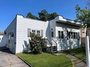 INVESTORS SPECIAL! 203k loan accepted Water front property in need of some TLC. Great investment property located in Baldwin Harbor with 4 bedrooms, 3 full bathrooms, a kitchen, living room and dining room. Perfect Spring/Summer home!