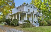 Nestled in the heart of the village of Red Hook, this historic grand Victorian offers the best of both worlds. Only steps away from beloved shops and restaurants, yet over an acre of privacy in the backyard, including multiple out buildings, studio space, in-ground pool and plenty of space to relax. The covered wraparound porch invites you into a classic front foyer and parlor space, which can be used for either business or pleasure thanks to the home&rsquo;s R-20 zoning. This zoning also would allow a Bed & Breakfast usage. There are four separate areas on the first floor that can service as a living room, with plenty of cozy nooks to curl up with a book by the wood-burning fireplace. The kitchen opens into a sunlit dining area and living room, offering openness and warmth. Legally a 9-bedroom, it&rsquo;s currently functioning as a 5-bedroom, 3 1/2 baths, with possible room to grow if you finish the walk-up attic. The home is spacious and bright, with gorgeous original details throughout. Wonderful surprises in the private backyard include a large garden shed, detached 2 car garage with an attached workshop, a large studio space with lofted, beamed ceiling and propane heat (previously an art studio), and two smaller storage rooms conveniently at the far end. Built to last in 1890 and lovingly enhanced for 45 years by one family with care. Recent updates include a new pool liner, oil tank and furnace. Red Hook Schools. Come experience this Victorian dream! Additional Information: HeatingFuel:Oil Above Ground, ParkingFeatures:2 Car Detached, Appliances: Electric Water Heater InteriorFeatures: Built-in Features,