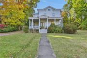 Nestled in the heart of the village of Red Hook, this historic grand Victorian offers the best of both worlds. Only steps away from beloved shops and restaurants, yet over an acre of privacy in the backyard, including multiple out buildings, studio space, in-ground pool and plenty of space to relax. The covered wraparound porch invites you into a classic front foyer and parlor space, which can be used for either business or pleasure thanks to the home&rsquo;s R-20 zoning. This zoning also would allow a Bed & Breakfast usage. There are four separate areas on the first floor that can service as a living room, with plenty of cozy nooks to curl up with a book by the wood-burning fireplace. The kitchen opens into a sunlit dining area and living room, offering openness and warmth. Legally a 9-bedroom, it&rsquo;s currently functioning as a 5-bedroom, 3 1/2 baths, with possible room to grow if you finish the walk-up attic. The home is spacious and bright, with gorgeous original details throughout. Wonderful surprises in the private backyard include a large garden shed, detached 2 car garage with an attached workshop, a large studio space with lofted, beamed ceiling and propane heat (previously an art studio), and two smaller storage rooms conveniently at the far end. Built to last in 1890 and lovingly enhanced for 45 years by one family with care. Recent updates include a new pool liner, oil tank and furnace. Red Hook Schools. Come experience this Victorian dream! Additional Information: HeatingFuel:Oil Above Ground, ParkingFeatures:2 Car Detached, Appliances: Electric Water Heater InteriorFeatures: Built-in Features,