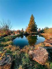 Stamford, NY. Scenic southern exposure and waterfalls which run all year round!!!  Gorgeous waterfront views. 4, 20 ft deep ponds, natural spring water and a 25-acre lake located directly across the street. Accessible via paved road with telephone and electricity. The waterfalls were created from 10-20 ton megalithic blue stone quarried from the mountain. There are no pumps to move the water, it always runs and is the headwaters of the Delaware River.