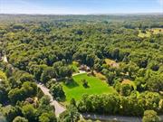 Situated on sought after Bedford Center Road in Bedford Hills. This property encompasses a cottage, and a 1900&rsquo;s carriage barn with a legal barn apartment. The open and rolling 4 acres provides possibilities for someone with a vision. Possibilities include converting the barn to a main residence. The property has the space for a pool and gardens. Countryside living within five minutes of major highways and Metro North train station suits both the year-round and weekend homeowner. This is a wonderful opportunity to make this beautiful property into a special place for years to come. Being sold as is!