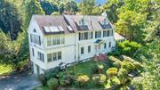 Welcome to this beautiful Colonial home, blending timeless charm with modern comforts. Located in scenic Croton-on-Hudson, this estate spans 2 lots totaling 4.75 acres, offering privacy, and income potential. Bedroom count, sq. footage and property tax includes cottage and Two Parcels (55.18-2-3 and 55.18-2-2). The main floor features a foyer, a formal DR, LR with fireplace, a family room, and solarium all bathed in natural light. The galley kitchen is the heart of the home, with custom cabinetry and stainless steel appliances, complemented by a wet bar + wine cooler. Upstairs, the 2-room primary suite offers ample closet space and a full bath, while 3 additional bedrooms and a sun-filled patio create the perfect retreat. The third floor provides two extra rooms. Outside, enjoy an in-ground pool and lush landscaping. A 2 level cottage includes a rental apartment and a lower-level space w/ full bath, ideal for a home office, gym or pool-house. This estate is a lifestyle waiting for you! Additional Information: HeatingFuel:Oil Above Ground, ParkingFeatures:2 Car Attached,