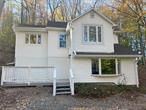 Paradise found! Come see this lovely light bright and airy cottage in the lovely area of Sullivan County. This beautiful and freshly revitalized home is the perfect year round or summer getaway home. Vaulted ceilings let in the cheerful sunlight and the tree dappled views of the natural surroundings right near Lake Paradise. Many updates including new carpet & luxury vinyl plank hardwood flooring throughout, fresh paint, new butcher block counters, new stainless appliances, brand new well pump and so much more! Lots of value here. AS-IS Sale, seller discloses that septic has failed and it may not qualify for traditional financing.