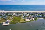 Unique opportunity to own a bayfront home in Westhampton Dunes! Use the existing cottage as is or while you plan to renovate or build your dream waterfront home. The pre-existing cottage features 3 bedrooms and 2.5 bathrooms, open kitchen, and great room overlooking the bay with a large deck. The Pre-existing non conforming foot print of house and deck offers a large building envelope to rebuild a new FEMA compliant home with in the pre-existing footprint (approximately 1, 992 sq. ft. foot print). The Bulkheaded waterfront offers breathtaking views of the open bay. Call for more information or to set up a viewing.