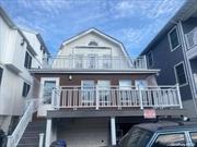 Renovated 4 Bedroom 2 Bath apartment with front porch. New Kitchen with new appliances. 2 New Bathroom. Beach block.