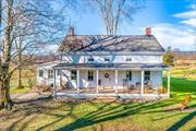 Meticulously restored farmhouse overlooking the Shawangunk Ridge on 41.8 pristine acres in Gardiner NY. The property includes an addition creating a Great Room kitchen with distressed mushroom wood cabinets, soapstone farm sink and countertops with butcher block center island a living room and dining area a brick fireplace and wide board floors with radiant heat. The kitchen is gourmet and has an AGA oven. Den has a second brick fireplace. Upstairs is a Main Bedroom private office walk-in closet private balcony and bath with soaking Bain claw foot tub. Four more bedrooms and a full bathroom complete the second floor The dairy barn is original and still has the stanchions and feeding trough in place. Second floor of the barn is the old hayloft and could be finished for separate office space or studio. 1.5 hours from Manhattan 15 minutes to New Paltz, Mohonk Preserve, Minnewaska State Park, wineries breweries farm stands farm to table venues & world class rock climbing. Live your dream.