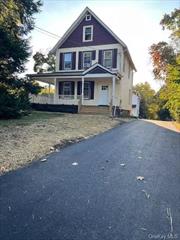 Charming, old style colonial home with the sweetest lemonade wrap around porch just perfect for hot apple cider mornings! This home is very unique with hardwood floors, decorative nooks, adorable built-ins, wide baseboards, four bedrooms, two full baths and two kitchens; great for an extended family. Upstairs kitchen has dishwasher. You owe it to yourself to see this beauty in the heart of Blauvelt. Private washer and dryer and ample parking