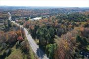 Beautiful 30+ acres of vacant land in the desirable town of Bethel is strategically positioned on the gateway corridor between Monticello and White Lake near area lakes and Bethel Woods Center for the Arts. Tremendous amount of exposure makes this a perfect choice for commercial use with large frontage of over 800 feet on New York State Route 17B. This parcel is fairly level throughout with mature trees and light growth and a driveway cut in from a previous residence. Favorable zoning allows for residential as well as commercial use (zoning table attached in docs). Just a few minutes from NYS Route 17/ Interstate 86, Sullivan County International Airport, Resorts World Catskills Casino, Kartrite Waterpark, the exclusive Monticello Motor Club and many more attractions the Sullivan County Catskills has to offer. Property is located near to Smallwood, Jenna Estates, and Tallwood communities, and on the main access Route to Western Sullivan County - great location for service businesses, medical offices or retail establishments.