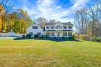 Set on over 3 acres in Quaker Hill, this beautiful Colonial offers flexibility, privacy, and endless potential. The open floor plan includes a formal dining room, inviting family room with a gas fireplace, and a kitchen with granite countertops and stainless steel appliances.A mudroom accessed from the 2 gar garage helps keep messy shoes and coats organized and out of sight. Upstairs, the primary suite features a spa-like bath and an extra-large walk-in closet. Bonus rooms throughout provide the perfect setup for a home office, gym, media room or whatever your imagination dreams up. You&rsquo;ll also love the partially fenced yard, room for gardening or even space to have your own chickens.